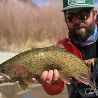 a man holding a fish
