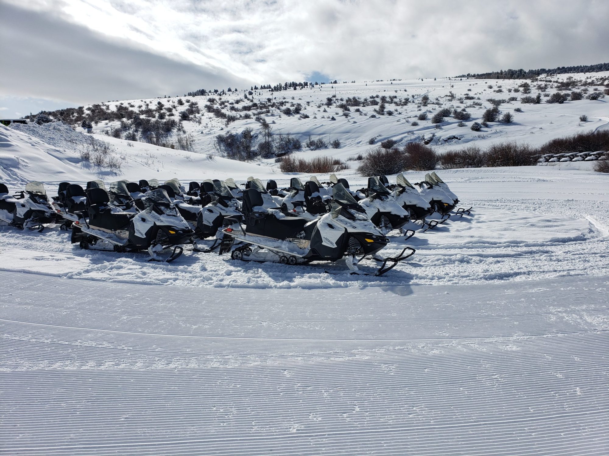 20200210_125659-scaled-1 a group of snowmobiles