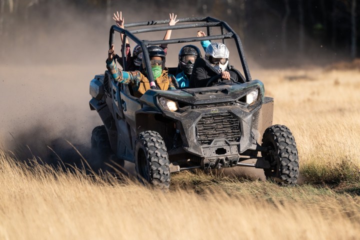 a truck driving down a dirt road