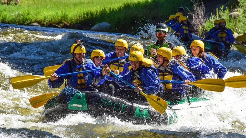 Private Upper Eagle Image 1 a group of men riding on the back of a raft