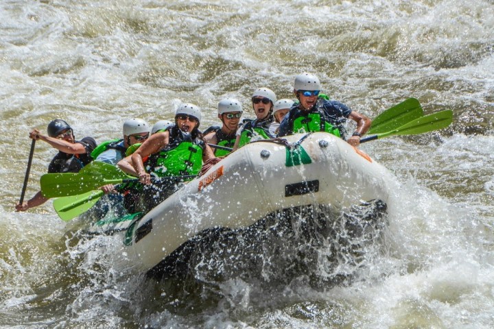 a man riding a wave on a surfboard in the water