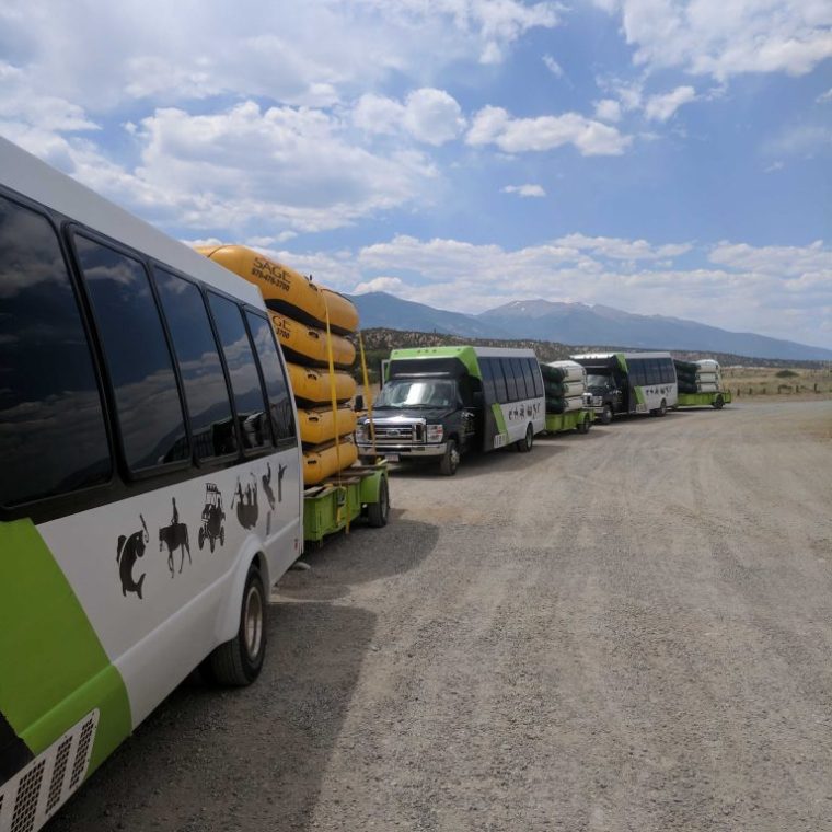 a passenger bus that is parked on the side of a road