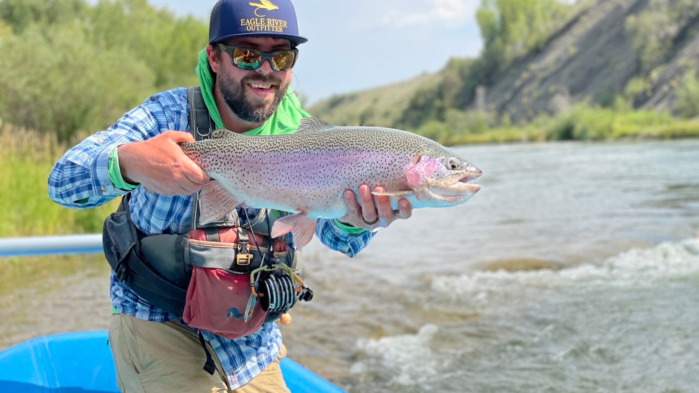 a man holding a fish in the water