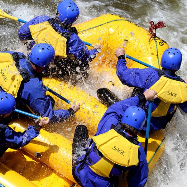 a group of people on a raft