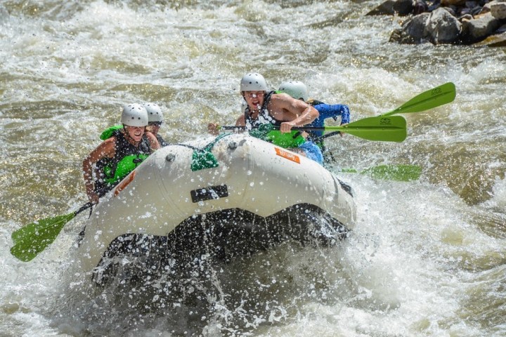 a man riding a wave on a surfboard in the water