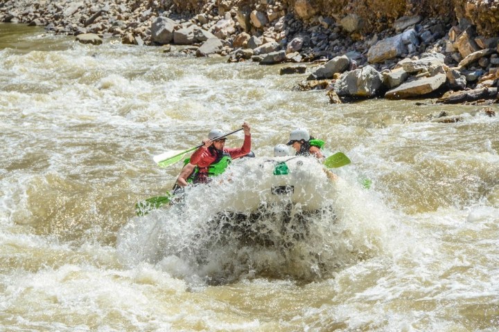 a person riding a wave on top of a body of water