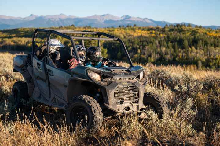 a truck that is sitting on top of a dry grass field