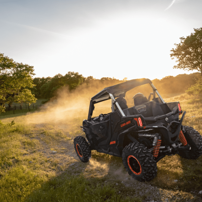 a car driving down a dirt road