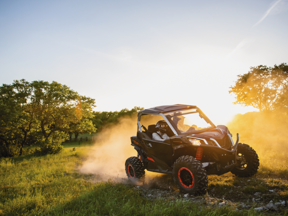 a car driving down a dirt road