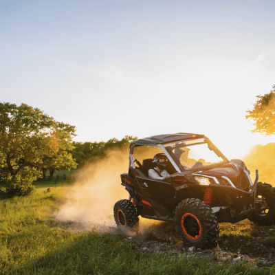a car driving down a dirt road