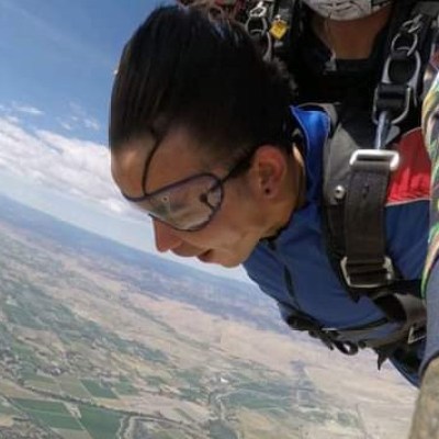 a man standing in front of a mountain