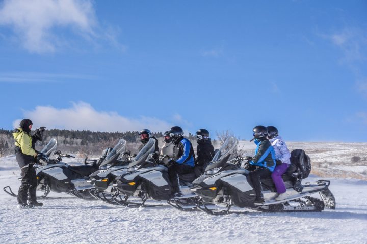 a group of people skiing on the snow