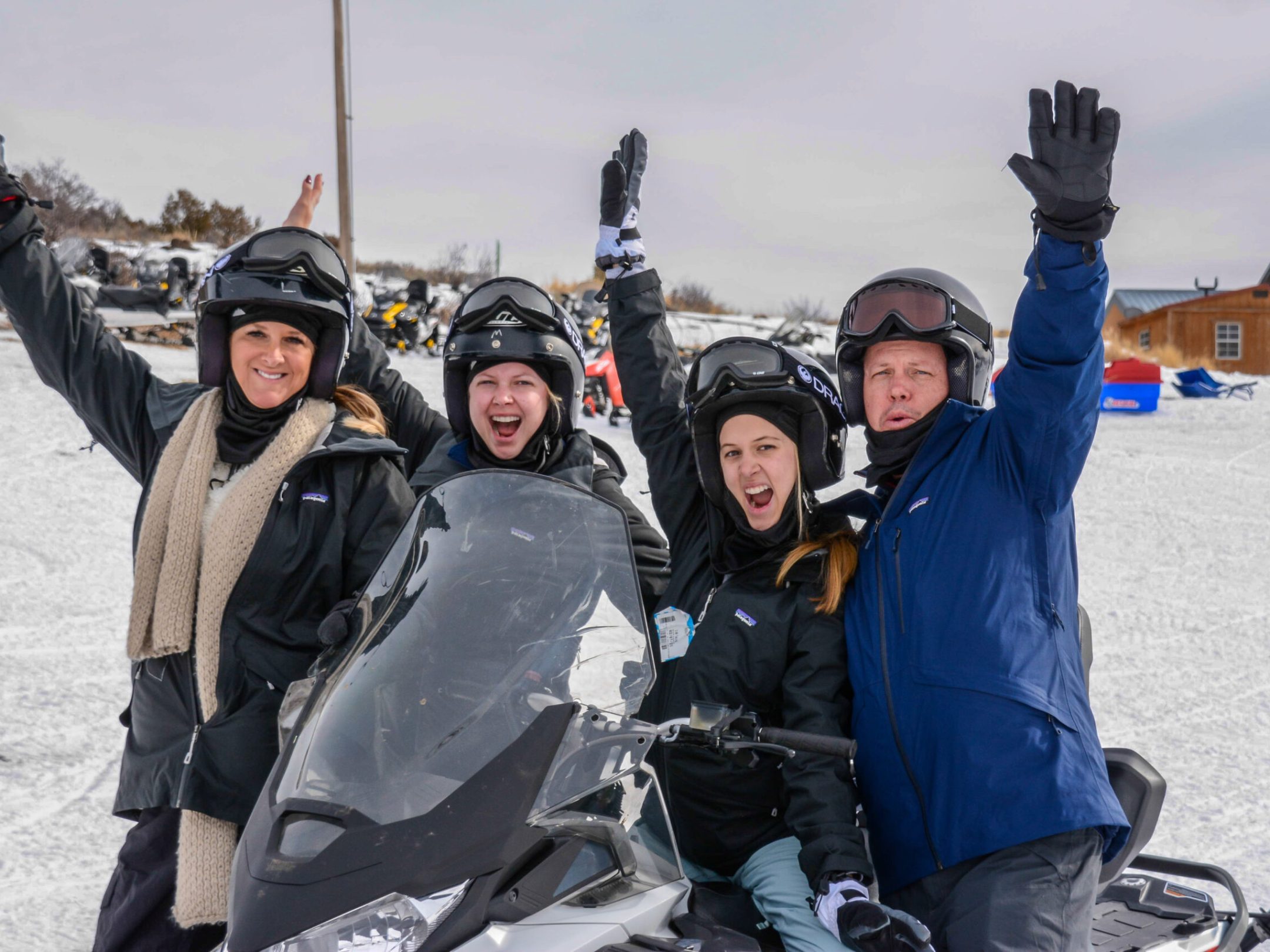 a couple of people that are sitting in the snow