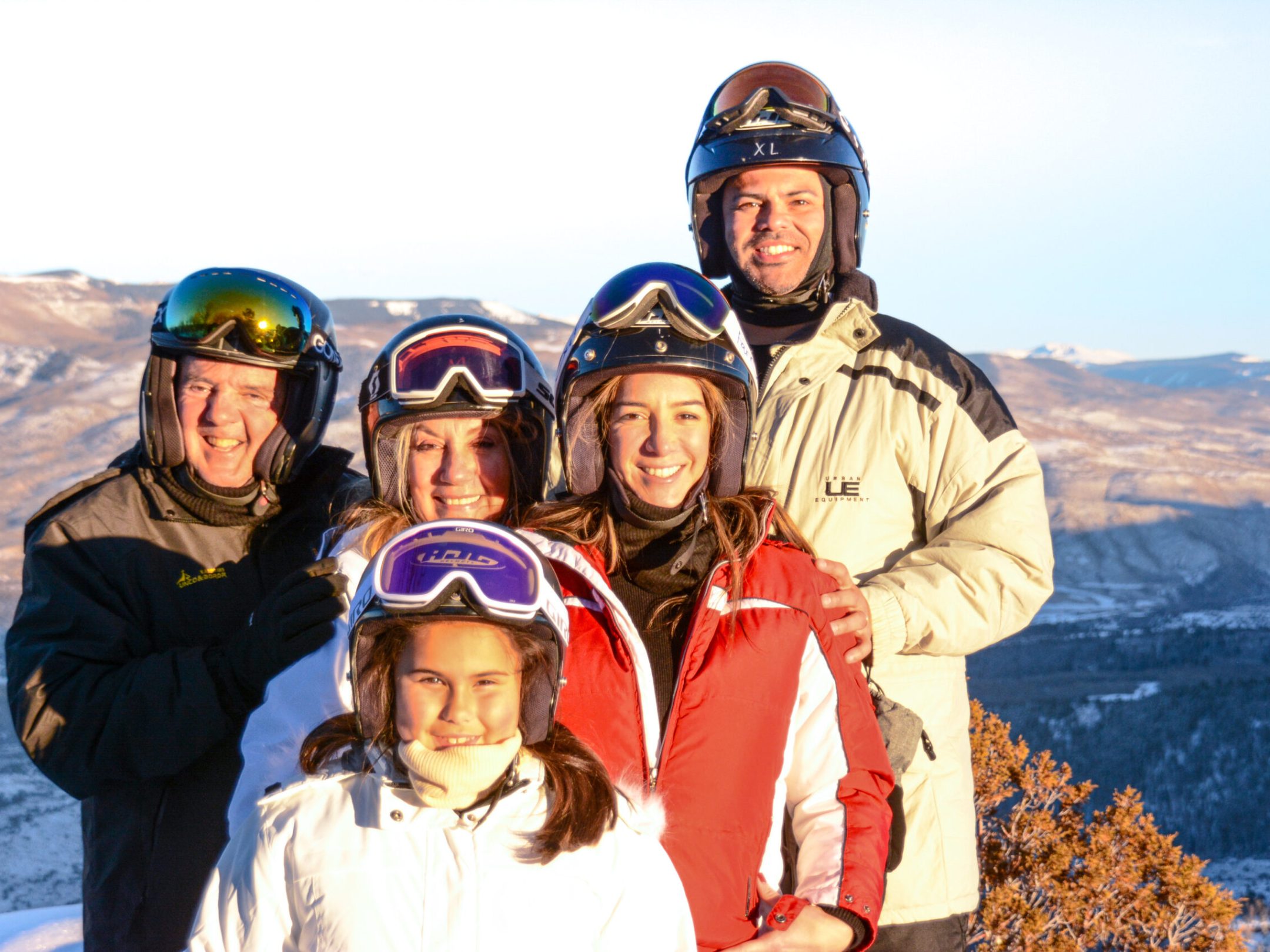 a couple of people that are standing in the snow