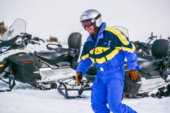 a person that is standing in the snow