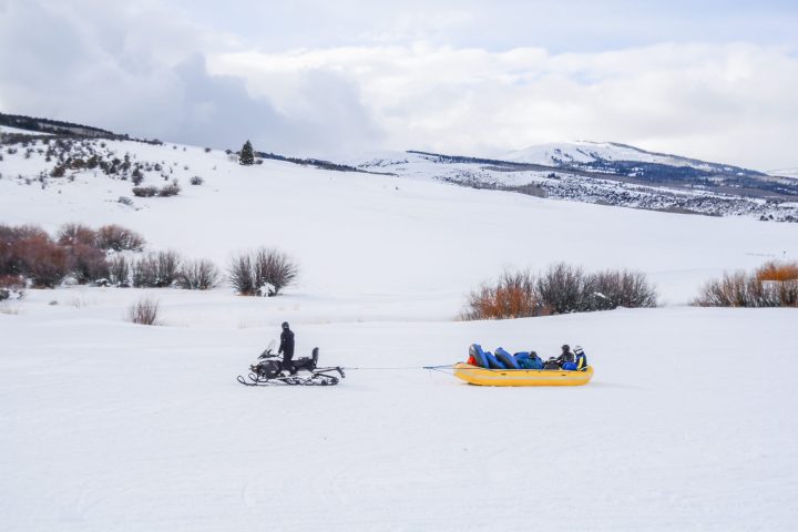 a person riding skis down a snow covered slope