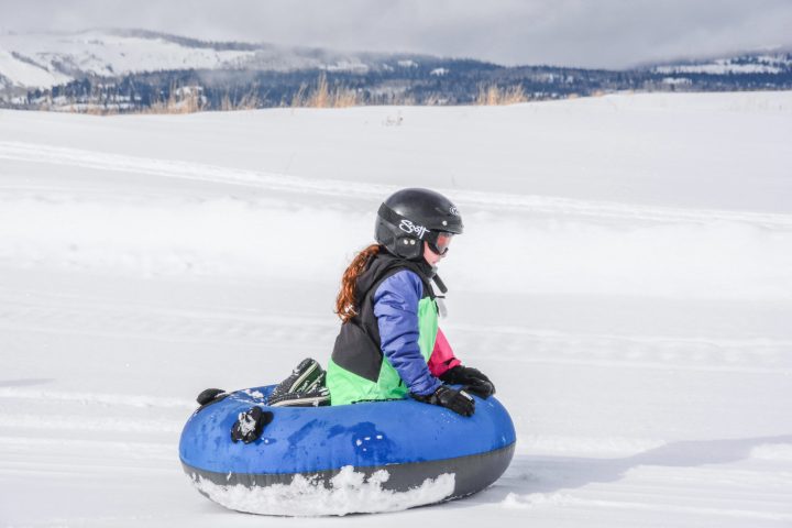 a person riding a snow board on a body of water