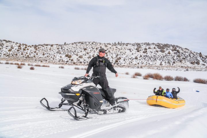 a man riding a bike in the snow
