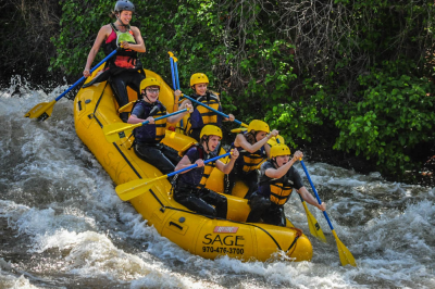 a group of people riding on a raft