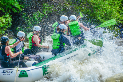 a group of people riding on the back of a boat