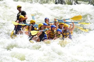 a group of people on a raft in the water