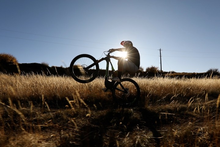 a person riding a motorcycle in a field